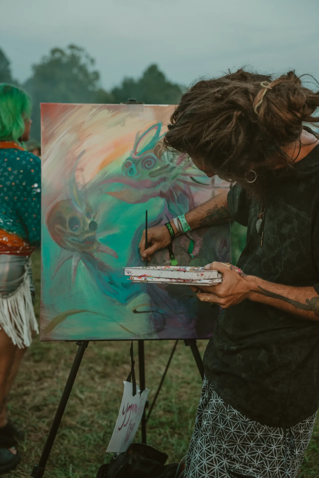 An artist painting live at Sound Haven